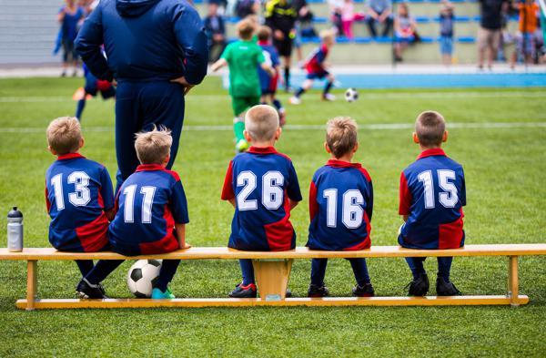 Soccer players on a bench