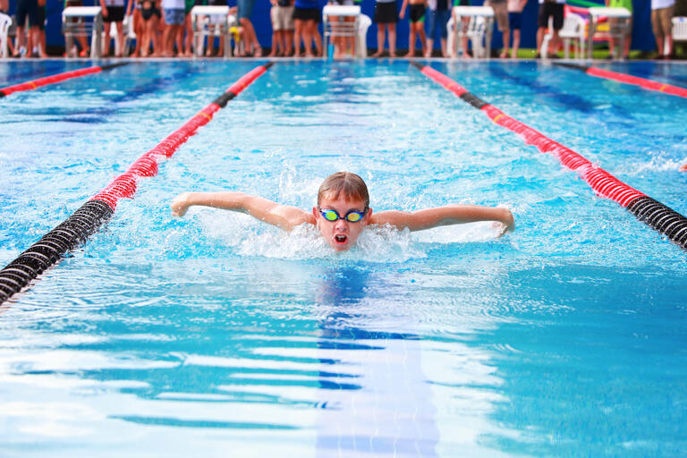 Boy swimming butterfly