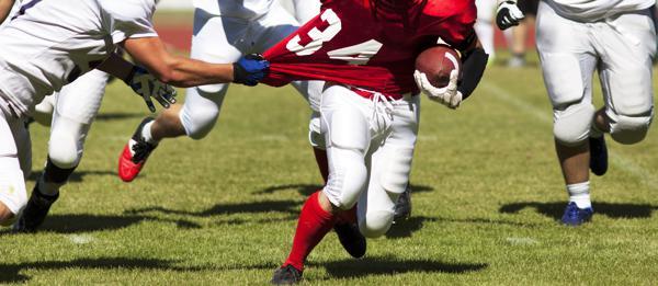 Player breaking a tackle