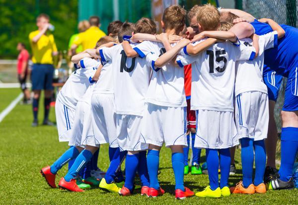 Soccer players huddled