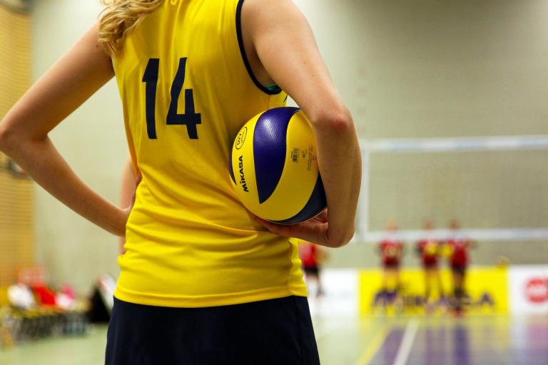 Girl holding volleyball