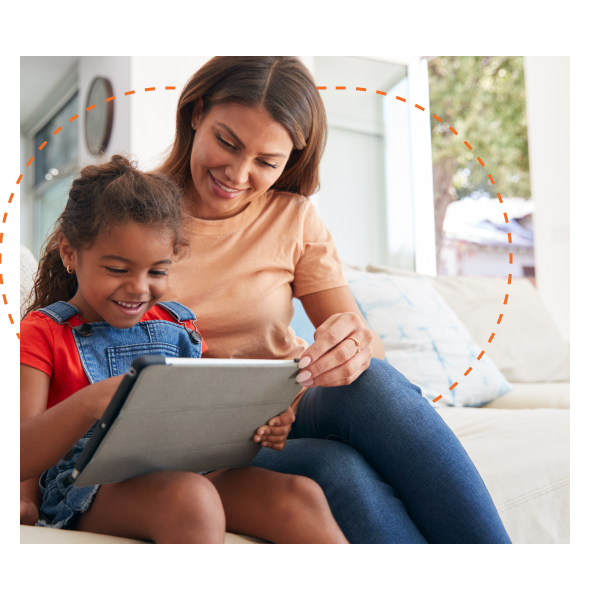 Family at home on couch using tablet together